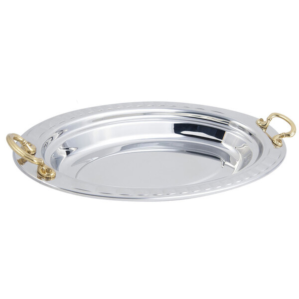 A silver Bon Chef oval food pan with round brass handles.