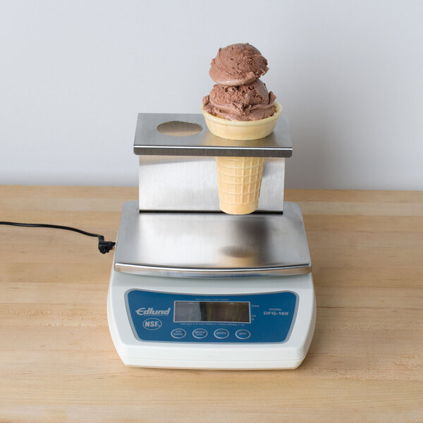 An Edlund digital portion scale with an ice cream cone platform weighing a waffle cone.
