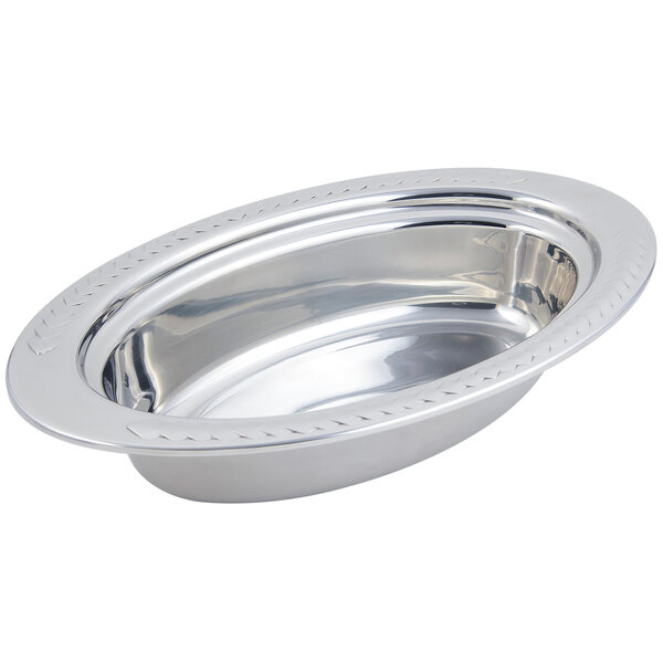 A silver stainless steel oval food pan with a Laurel design rim.