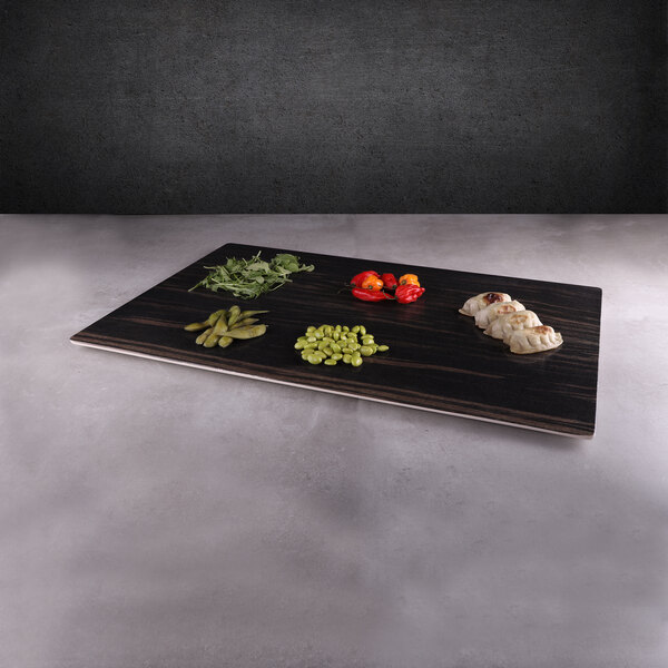 An Elite Global Solutions rectangular faux zebra wood melamine serving board with a variety of vegetables and beans on it.