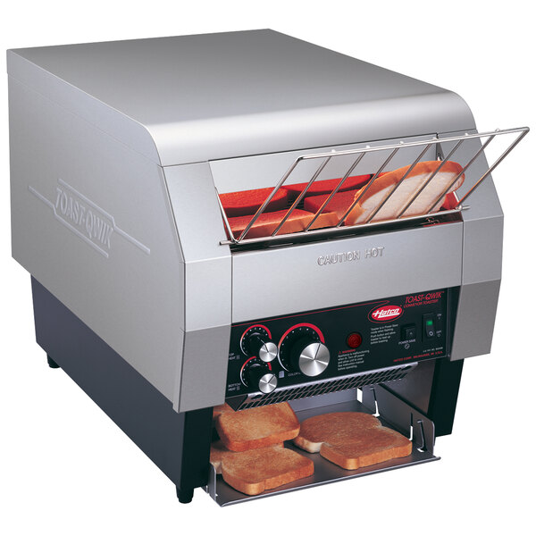 A Hatco TQ-800 conveyor toaster with bread inside.