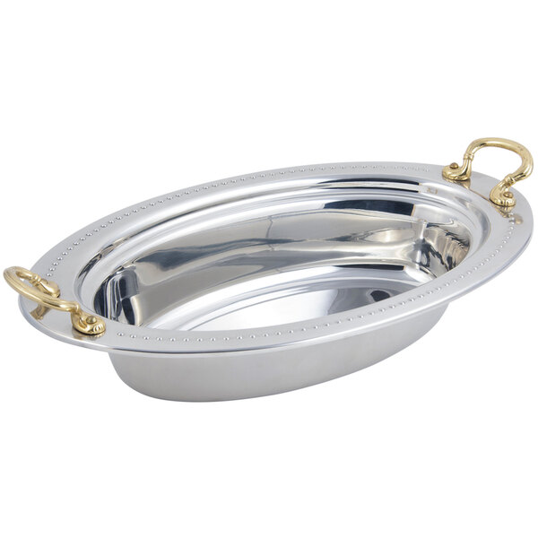 A silver and gold oval Bon Chef Bolero food pan with round brass handles.