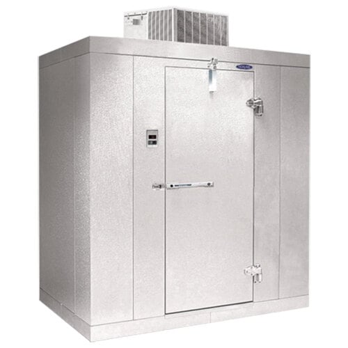 A white metal Norlake Kold Locker without floor with a white door open.