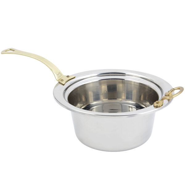 A silver stainless steel casserole food pan with a long brass handle.