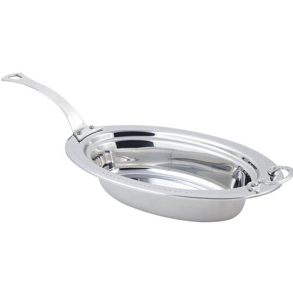 A Bon Chef stainless steel oval food pan with long handle.