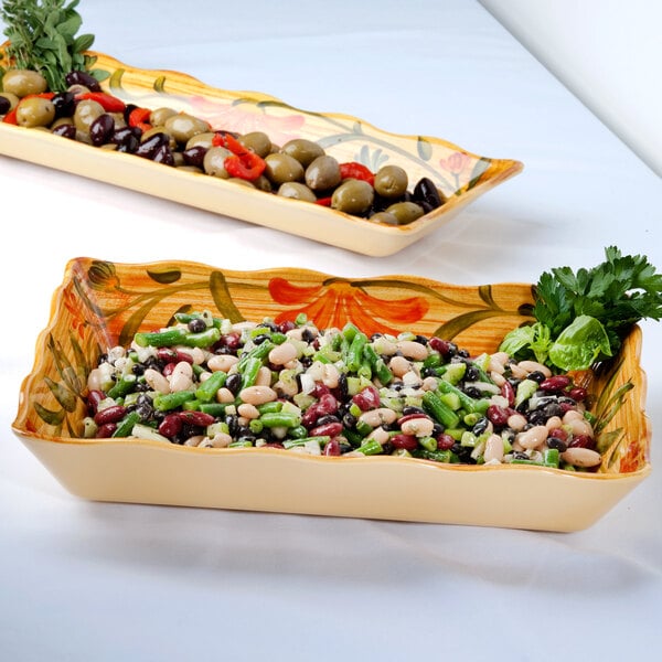 A rectangular melamine tray with vegetables and olives.