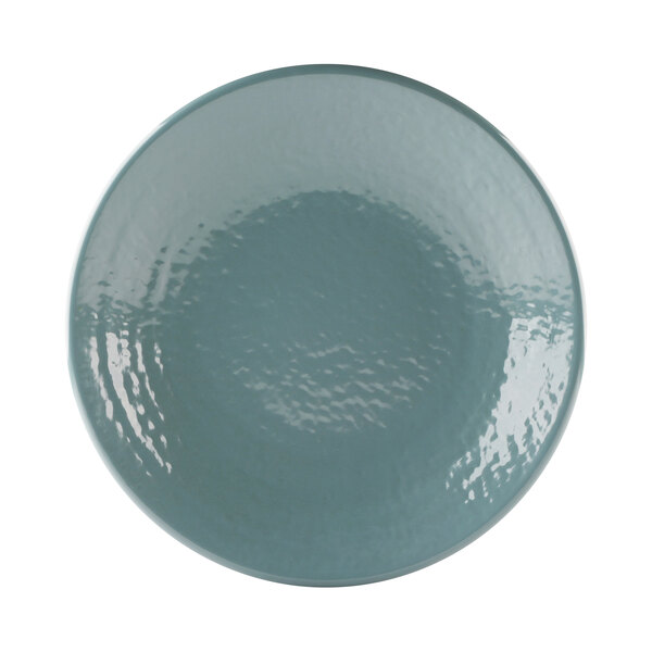 An abyss-blue melamine plate with a wavy pattern.