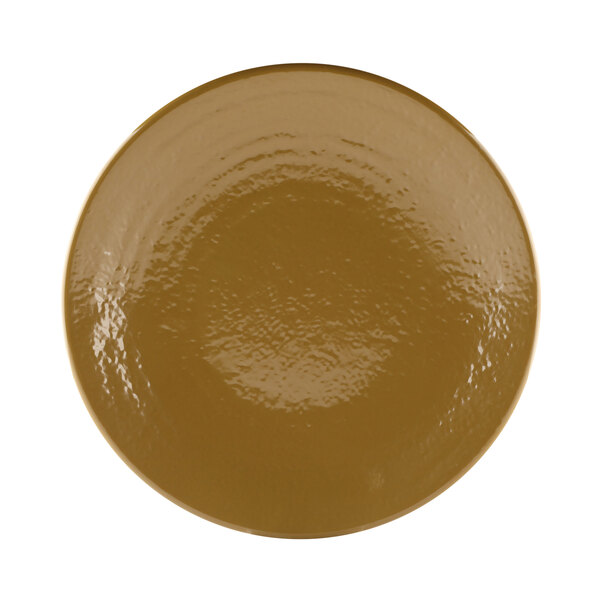 A close-up of an Elite Global Solutions Pebble Creek Tapenade-colored round plate with a shiny brown surface.