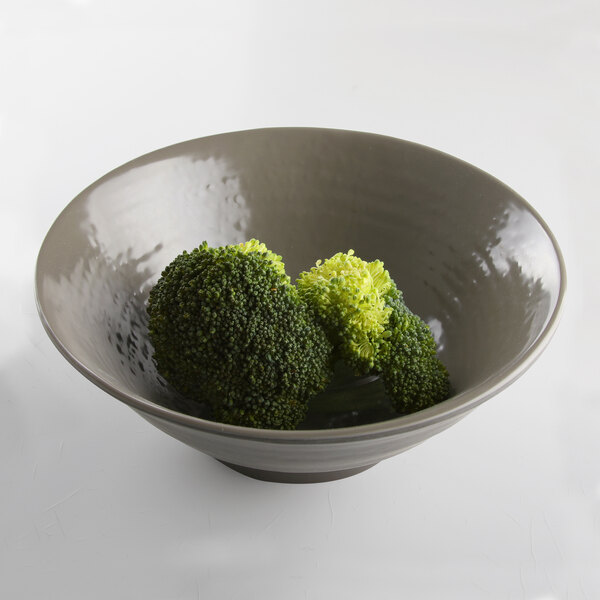 A Elite Global Solutions Pebble Creek mushroom-colored melamine bowl filled with broccoli.
