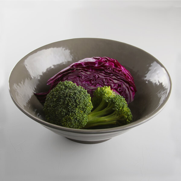 A Elite Global Solutions Pebble Creek mushroom-colored melamine bowl filled with broccoli and cabbage.