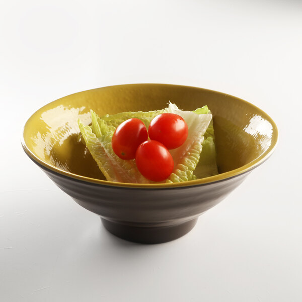 An Elite Global Solutions melamine bowl with lettuce and tomatoes in it.
