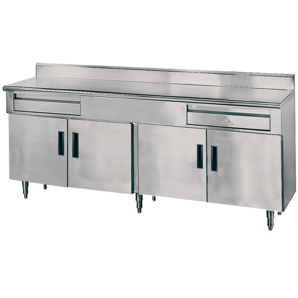 A stainless steel Advance Tabco kitchen work table with drawers.