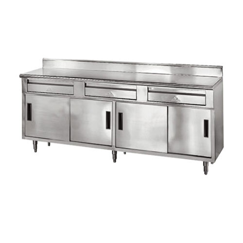 A stainless steel kitchen counter with drawers and sliding doors.