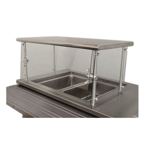 An Advance Tabco stainless steel cafeteria food shield over a counter.