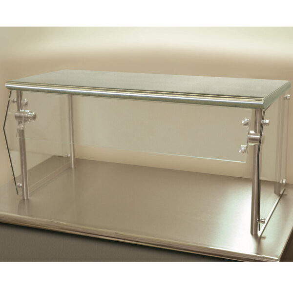 An Advance Tabco single tier food shield with a glass top and metal legs on a counter.