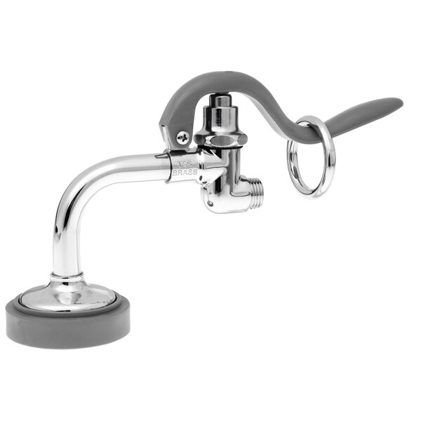 A T&S 90 degree pre-rinse spray valve on a faucet in a professional kitchen.