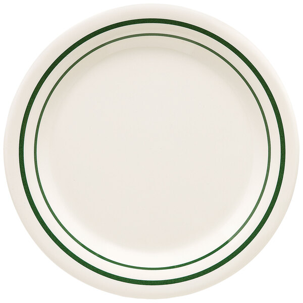 A white plate with green lines on the rim.
