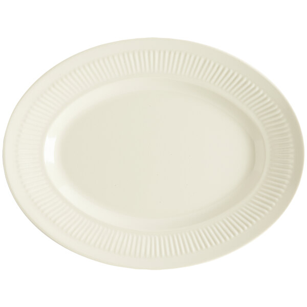 A white oval melamine platter with a pattern on it.