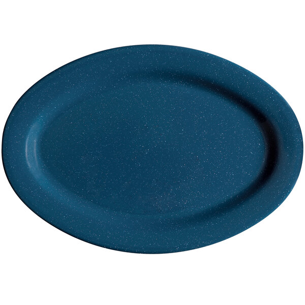 A white table with blue speckled oval platters.