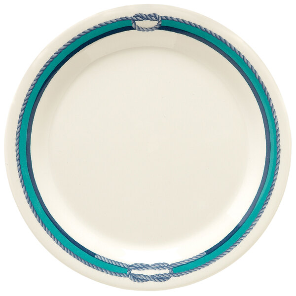 A white plate with blue and green stripes.