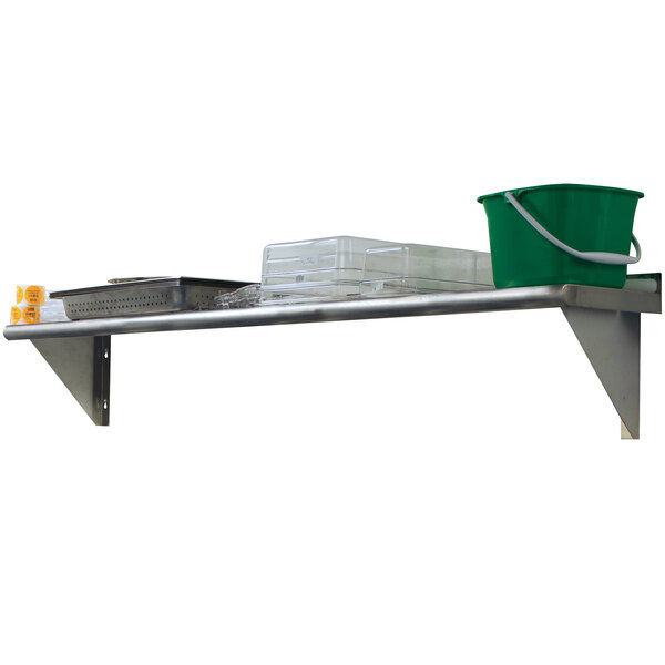 A stainless steel wall shelf with a green bucket on it.