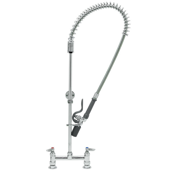 A close-up of a T&S chrome pre-rinse faucet with hose and sprayer.