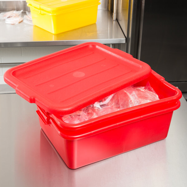 A red Vollrath Traex polypropylene food container with a lid open.