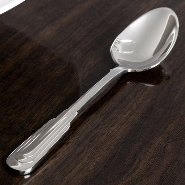 A Oneida Cityscape stainless steel teaspoon with a silver handle and bowl.
