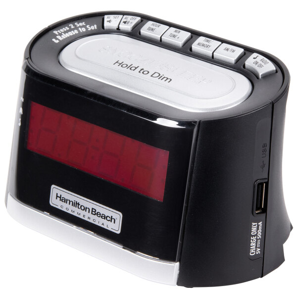A black Hamilton Beach alarm clock with a red digital display.