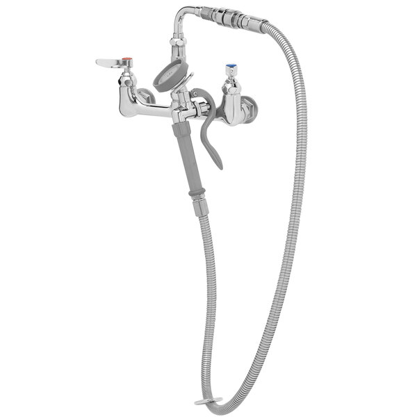 A chrome T&S wall mount faucet with a hose attached.