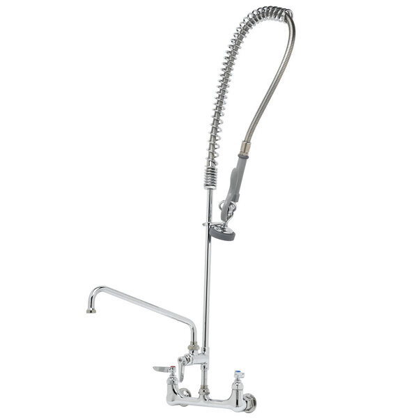 A T&S stainless steel wall mounted pre-rinse faucet with a hose.