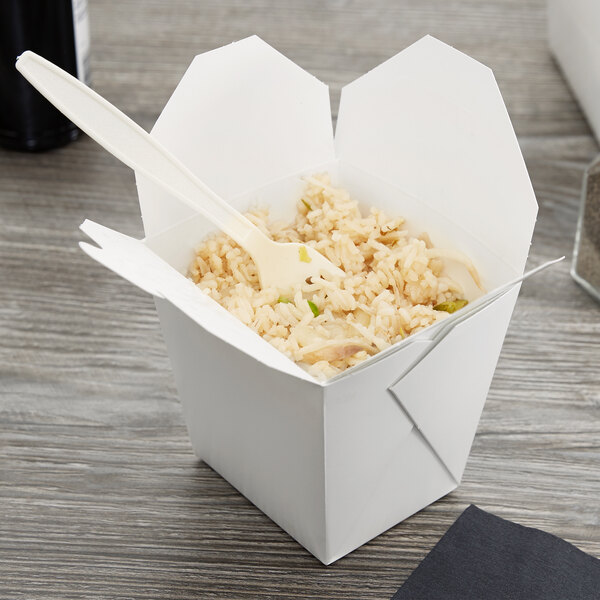 A white Fold-Pak take-out container with rice and chopsticks.