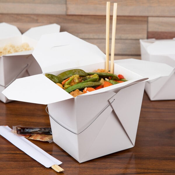 A white Fold-Pak Chinese take-out container with food inside.