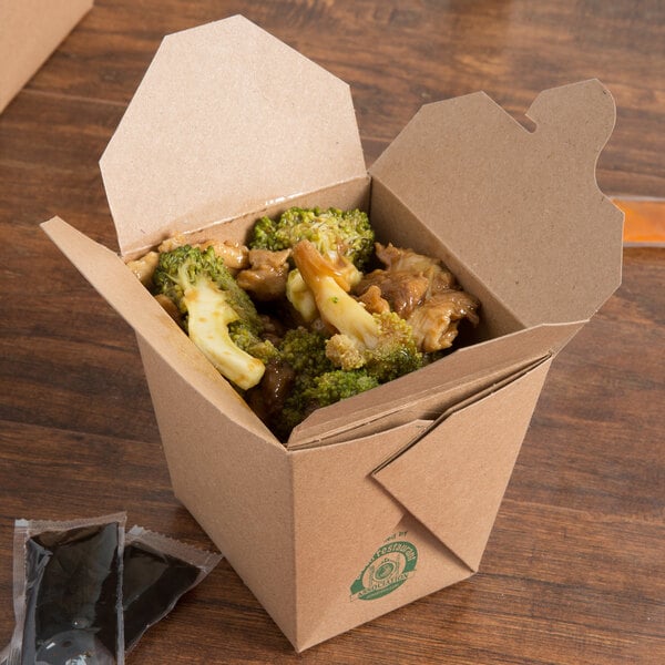 A Fold-Pak Earth Chinese take-out container on a table filled with broccoli and chicken.
