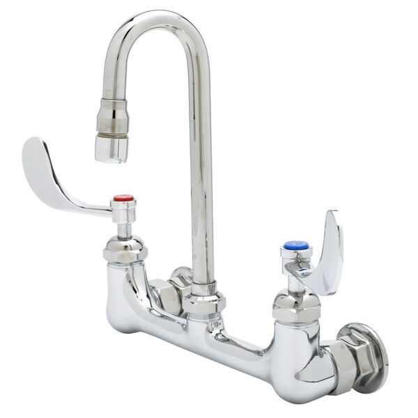 A white T&S wall mounted pantry faucet with 4" wrist action handles.