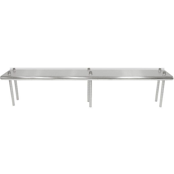 A long stainless steel table with a rear mounted stainless steel shelving unit.