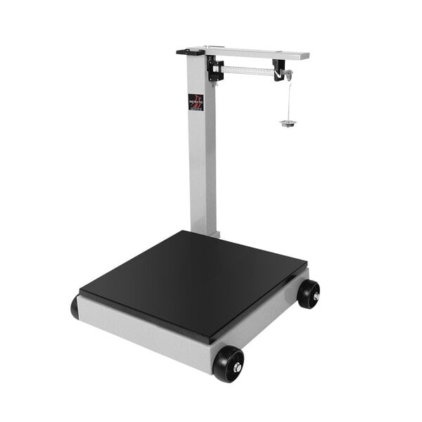 A grey and black Cardinal Detecto 500 kg. portable mechanical floor scale with a black square platform on wheels.