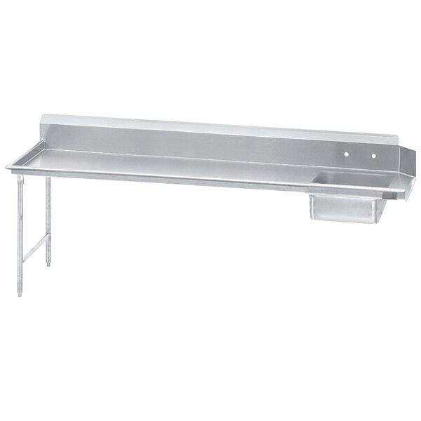 A stainless steel Advance Tabco soil dishtable with a shelf on the left.