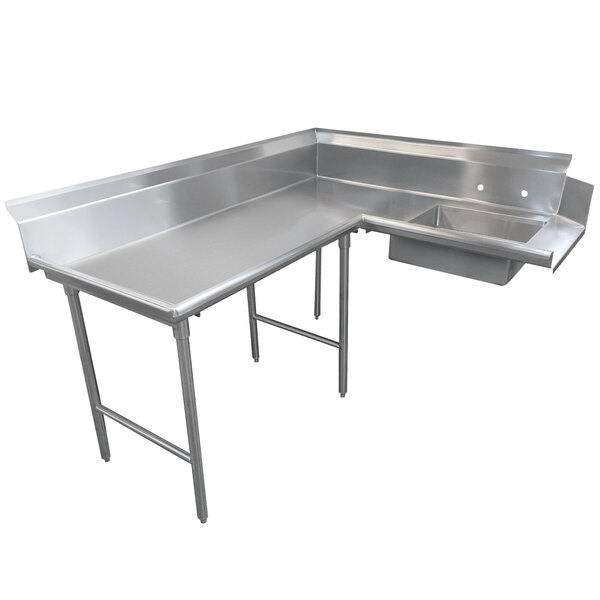 A stainless steel Advance Tabco L-shaped dishtable with a sink on the left.