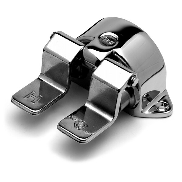 A chrome metal T&S pedal valve with metal handles.