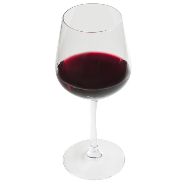 A close-up of a Chef & Sommelier Cabernet wine glass full of red wine.