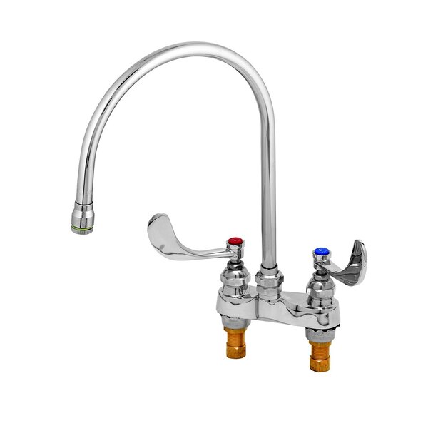 A chrome T&S deck mount medical faucet with curved wrist action handles.