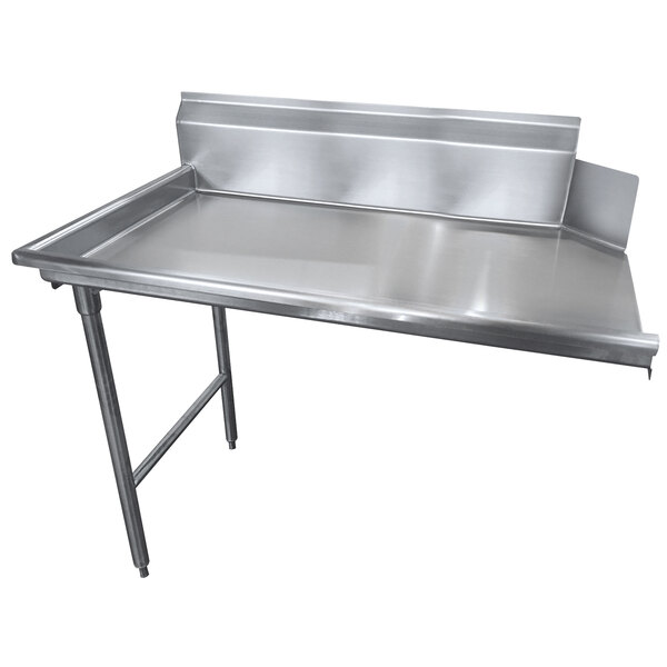 A stainless steel Advance Tabco clean dishtable with a metal frame.