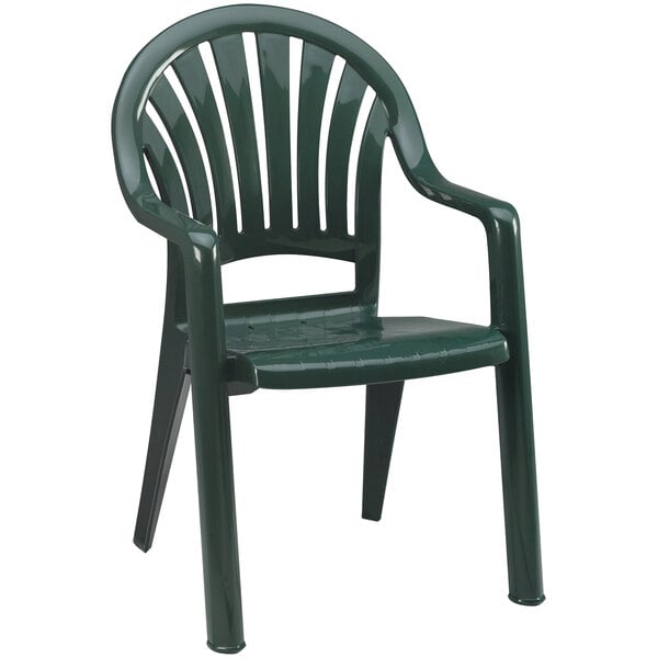 A pack of 4 green Grosfillex Pacific Amazon stacking resin armchairs.