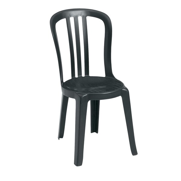 A close up of a black Grosfillex Miami outdoor stacking chair.