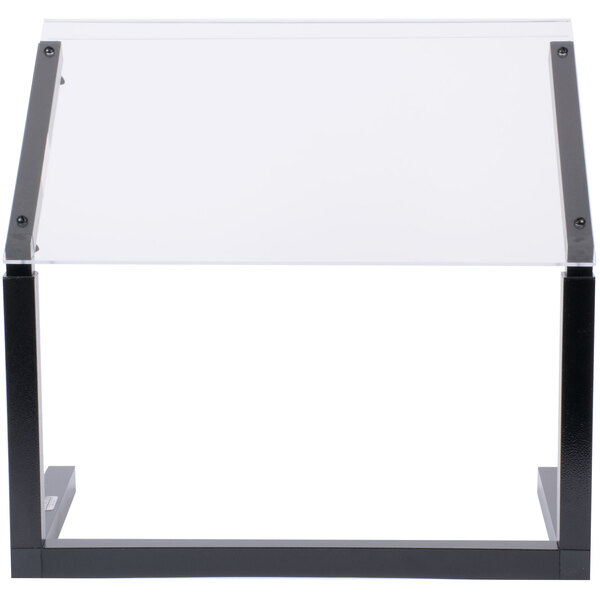 A white rectangular object with a black border on a clear plastic and black stand.