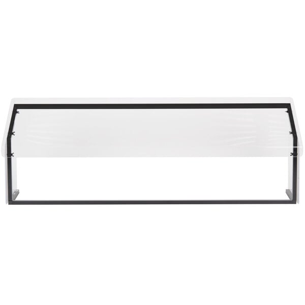 A black metal sneeze guard with a glass top on a white table with black trim.