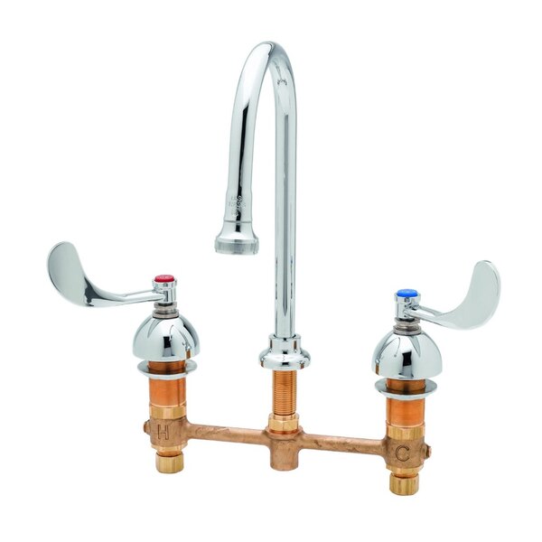 A chrome T&S deck-mount faucet with two gooseneck handles.