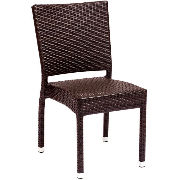 A brown wicker BFM Seating Monterey side chair.