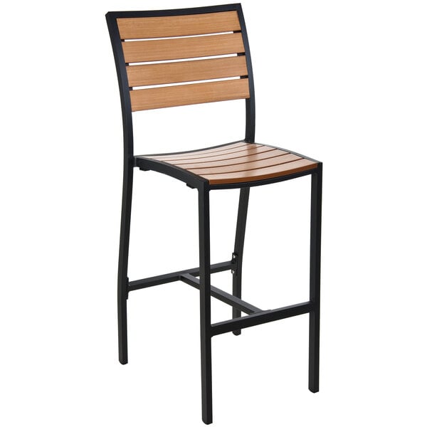 A BFM Seating Largo black bar stool with a synthetic teak seat.